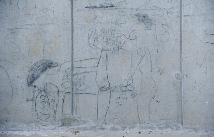Graffiti on a wall in Diepsloot where a penis is likened to an AK47. The Sonke Change found that men are about three times more likely to rape or beat a woman if they are a problem drinker.