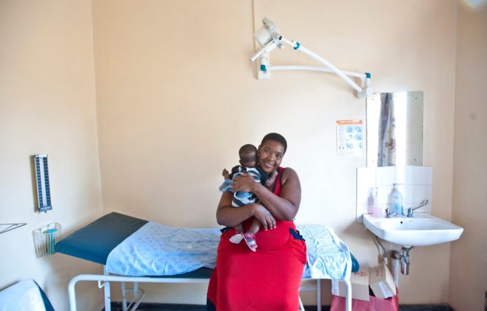 Happy Maifadi and her young son Enhle benefit from ongoing peer support from mothers2mothers.