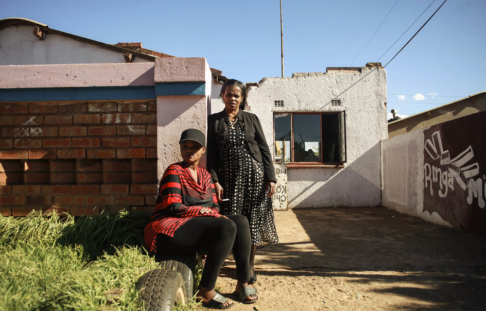 Jeanny Mbalati and her daughter Dinah outside their home in Soweto. It took them more than a year to get a loved one into a psychiatric hospital following his removal from Life Esidimeni facilities.