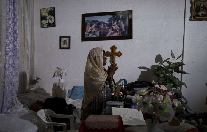 Prophetess Odasani says she drives out the spirits afflicting women who come to her backstreet ‘church’ in Palermo.