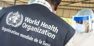 A World Health Organization official looks on as health workers in Conakry receive training during the 2015 Ebola outbreak in West Africa.