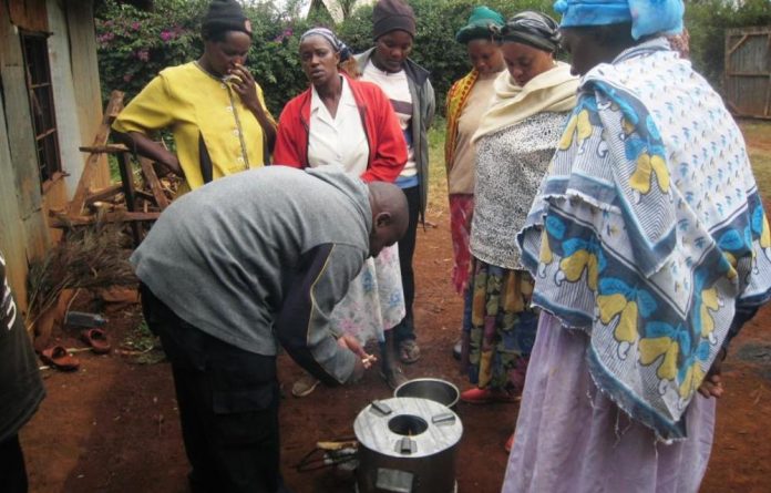 Keneth Ndua demonstrates his stove invention