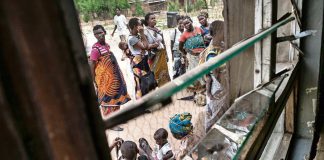 Women queue outside of a Malawian health facility for healthcare for their children. Moving rape crisis centres out of central hospitals in Malawi and into clinics closer to communities might increase the number of people who use them