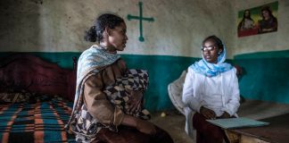 A health extension worker visits Brahini Mokonen at her home