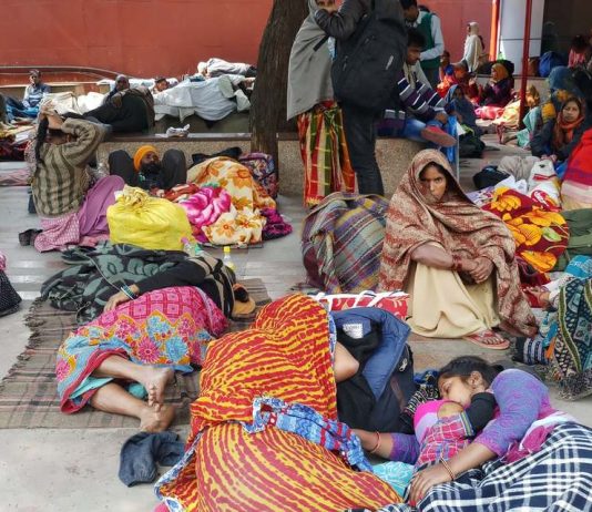 Families await medical treatment outside the All India Institute of Medical Sciences. Ayushman Bharat