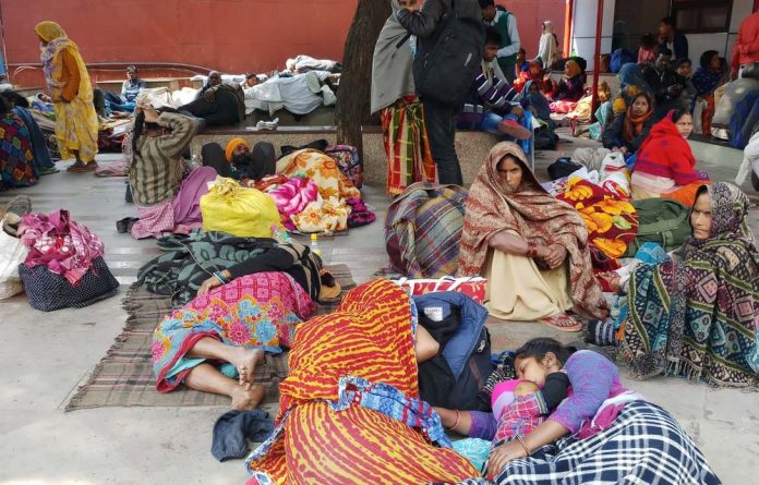 Families await medical treatment outside the All India Institute of Medical Sciences. Ayushman Bharat