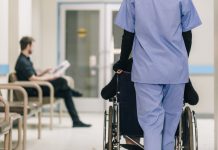 Nurse Pushing Wheelchair
